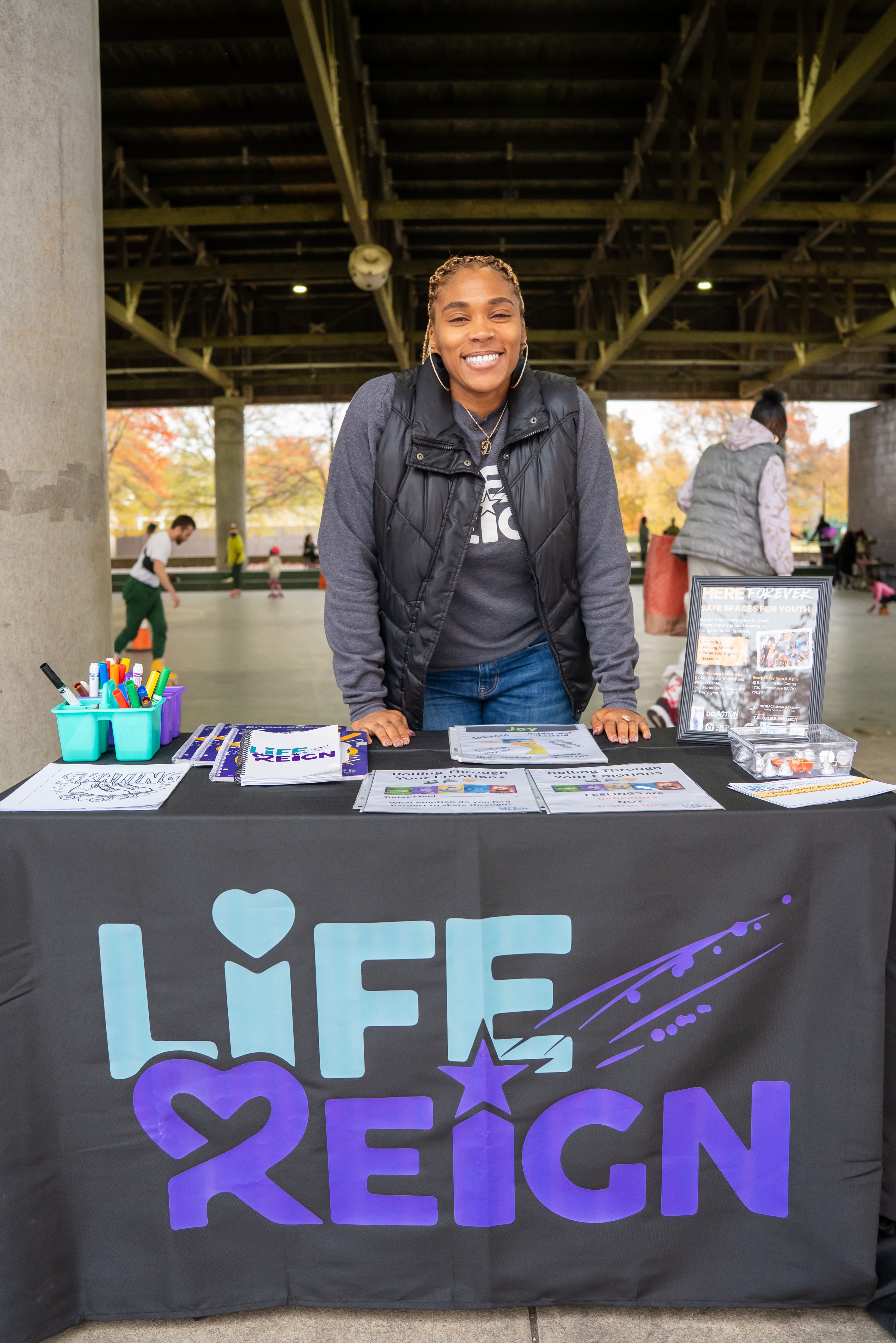 Dominique Moore at the Life Reign table at a Youth Safe Space activation